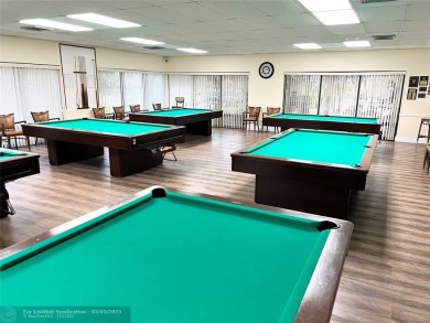 This charming two-bedroom, two-bath condo offers a cozy retreat on Sunrise Lakes Phase III in Florida - for sale on GolfHomes.com, golf home, golf lot