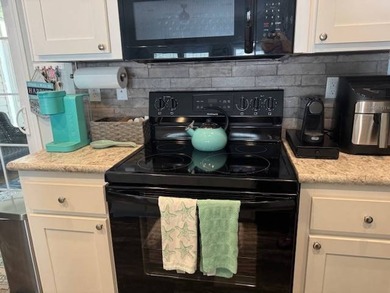 Welcome home to this impeccable 2-bedroom 2-bath sanctuary on Cypresswood Golf and Country Club in Florida - for sale on GolfHomes.com, golf home, golf lot