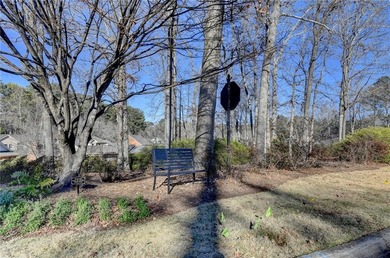 Nestled along the 5th fairway, this beautifully positioned home on Country Club of Roswell in Georgia - for sale on GolfHomes.com, golf home, golf lot