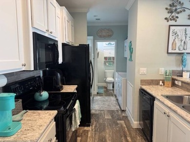 Welcome home to this impeccable 2-bedroom 2-bath sanctuary on Cypresswood Golf and Country Club in Florida - for sale on GolfHomes.com, golf home, golf lot