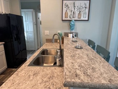 Welcome home to this impeccable 2-bedroom 2-bath sanctuary on Cypresswood Golf and Country Club in Florida - for sale on GolfHomes.com, golf home, golf lot