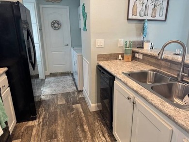 Welcome home to this impeccable 2-bedroom 2-bath sanctuary on Cypresswood Golf and Country Club in Florida - for sale on GolfHomes.com, golf home, golf lot