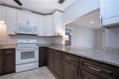 One or more photo(s) has been virtually staged. A lovely pond on Sandpiper Golf Club in Florida - for sale on GolfHomes.com, golf home, golf lot