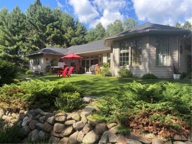 Discover this gem with everything you could wish for. Located on on Spider Lake Golf Resort in Wisconsin - for sale on GolfHomes.com, golf home, golf lot