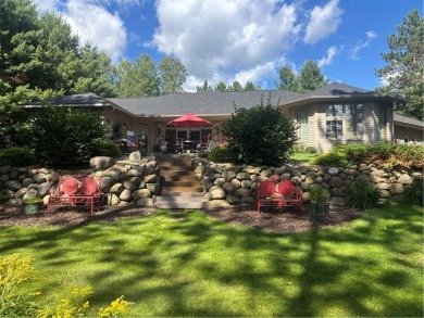 Discover this gem with everything you could wish for. Located on on Spider Lake Golf Resort in Wisconsin - for sale on GolfHomes.com, golf home, golf lot