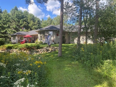 Discover this gem with everything you could wish for. Located on on Spider Lake Golf Resort in Wisconsin - for sale on GolfHomes.com, golf home, golf lot