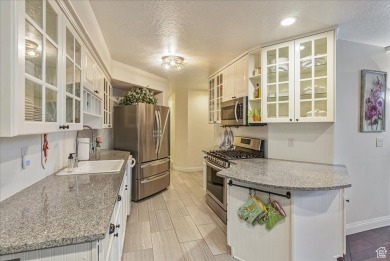 This renovated end-unit condo, featuring 3 bedrooms and 2.5 on Forest Dale Golf Club in Utah - for sale on GolfHomes.com, golf home, golf lot