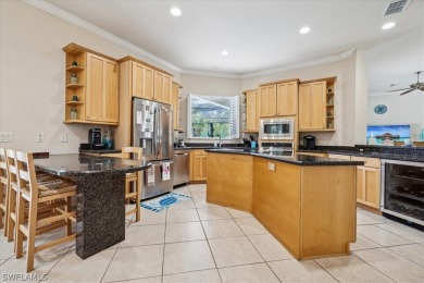 This gorgeous, updated home offers an expansive view of the lake on Gateway Golf and Country Club in Florida - for sale on GolfHomes.com, golf home, golf lot