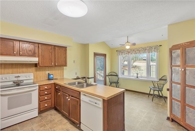 This traditional 4-bedroom, 3-bathroom home overlooks the 2nd on Cobbs Glen Country Club in South Carolina - for sale on GolfHomes.com, golf home, golf lot