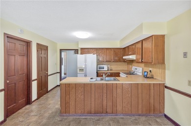 This traditional 4-bedroom, 3-bathroom home overlooks the 2nd on Cobbs Glen Country Club in South Carolina - for sale on GolfHomes.com, golf home, golf lot