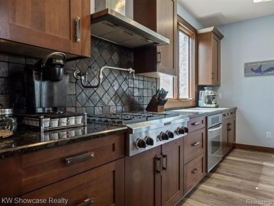 LAKE LIVING AT ITS FINEST ON PRIVATE - ALL SPORTS - LOWER on Edgewood Country Club in Michigan - for sale on GolfHomes.com, golf home, golf lot