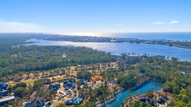 Serene wooded lot with pond in rear. Price includes ARB approved on Sharks Tooth Golf Club in Florida - for sale on GolfHomes.com, golf home, golf lot