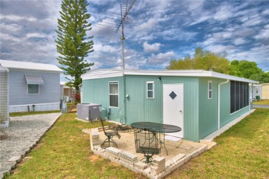 BEAUTIFULLY WELL-MAINTAINED FLORIDA GETAWAY in the desired GATED on Southern Dunes Golf and Country Club in Florida - for sale on GolfHomes.com, golf home, golf lot