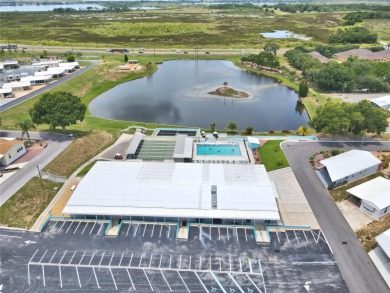 BEAUTIFULLY WELL-MAINTAINED FLORIDA GETAWAY in the desired GATED on Southern Dunes Golf and Country Club in Florida - for sale on GolfHomes.com, golf home, golf lot