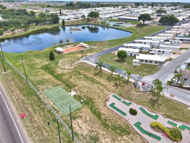 BEAUTIFULLY WELL-MAINTAINED FLORIDA GETAWAY in the desired GATED on Southern Dunes Golf and Country Club in Florida - for sale on GolfHomes.com, golf home, golf lot