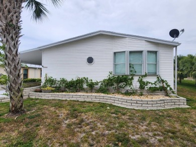 Welcome to this lovely 3BR/2BA located in the 55+ active adult on Spanish Lakes Fairways in Florida - for sale on GolfHomes.com, golf home, golf lot