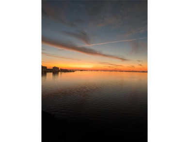 WATERFRONT LIFE AT ITS BEST! Spectacular sunsets, relaxing on The Dunedin Country Club in Florida - for sale on GolfHomes.com, golf home, golf lot