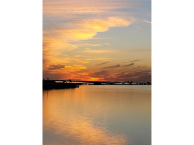 WATERFRONT LIFE AT ITS BEST! Spectacular sunsets, relaxing on The Dunedin Country Club in Florida - for sale on GolfHomes.com, golf home, golf lot