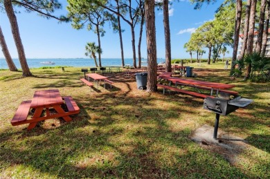WATERFRONT LIFE AT ITS BEST! Spectacular sunsets, relaxing on The Dunedin Country Club in Florida - for sale on GolfHomes.com, golf home, golf lot