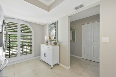 Enjoy elevated living in this beautifully updated two-bedroom on Royal Palm Golf Club in Florida - for sale on GolfHomes.com, golf home, golf lot