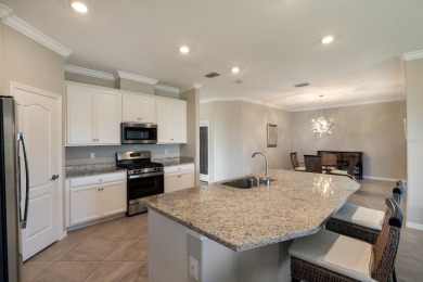 WATERFRONT VILLA IN HIGHLY SOUGHT AFTER ARBOR GRANDE IN LAKEWOOD on Esplanade Golf and Country at Lakewood Ranch in Florida - for sale on GolfHomes.com, golf home, golf lot