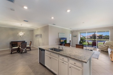 WATERFRONT VILLA IN HIGHLY SOUGHT AFTER ARBOR GRANDE IN LAKEWOOD on Esplanade Golf and Country at Lakewood Ranch in Florida - for sale on GolfHomes.com, golf home, golf lot