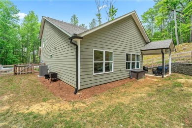 Ready to call this recently built home in Lake Arrowhead yours? on The Highlands Course at Lake Arrowhead in Georgia - for sale on GolfHomes.com, golf home, golf lot