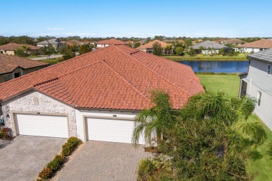 WATERFRONT VILLA IN HIGHLY SOUGHT AFTER ARBOR GRANDE IN LAKEWOOD on Esplanade Golf and Country at Lakewood Ranch in Florida - for sale on GolfHomes.com, golf home, golf lot