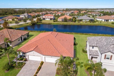 WATERFRONT VILLA IN HIGHLY SOUGHT AFTER ARBOR GRANDE IN LAKEWOOD on Esplanade Golf and Country at Lakewood Ranch in Florida - for sale on GolfHomes.com, golf home, golf lot