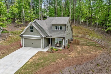 Ready to call this recently built home in Lake Arrowhead yours? on The Highlands Course at Lake Arrowhead in Georgia - for sale on GolfHomes.com, golf home, golf lot