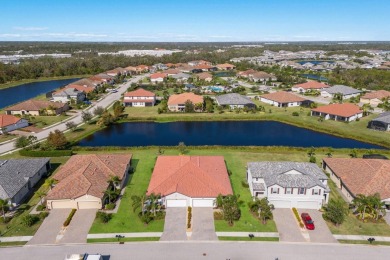 WATERFRONT VILLA IN HIGHLY SOUGHT AFTER ARBOR GRANDE IN LAKEWOOD on Esplanade Golf and Country at Lakewood Ranch in Florida - for sale on GolfHomes.com, golf home, golf lot