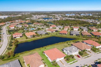 WATERFRONT VILLA IN HIGHLY SOUGHT AFTER ARBOR GRANDE IN LAKEWOOD on Esplanade Golf and Country at Lakewood Ranch in Florida - for sale on GolfHomes.com, golf home, golf lot