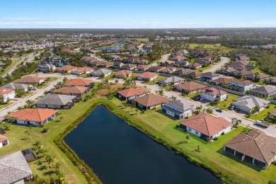 WATERFRONT VILLA IN HIGHLY SOUGHT AFTER ARBOR GRANDE IN LAKEWOOD on Esplanade Golf and Country at Lakewood Ranch in Florida - for sale on GolfHomes.com, golf home, golf lot