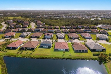 WATERFRONT VILLA IN HIGHLY SOUGHT AFTER ARBOR GRANDE IN LAKEWOOD on Esplanade Golf and Country at Lakewood Ranch in Florida - for sale on GolfHomes.com, golf home, golf lot