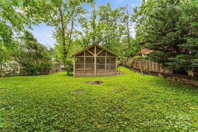 Views of Lake Tomahawk! This charming 2-bedroom/1-bath cottage on Black Mountain Golf Course in North Carolina - for sale on GolfHomes.com, golf home, golf lot