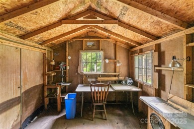 Views of Lake Tomahawk! This charming 2-bedroom/1-bath cottage on Black Mountain Golf Course in North Carolina - for sale on GolfHomes.com, golf home, golf lot