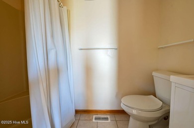 Sitting well elevated in an X flood zone, Sunny Days is located on The Currituck Golf Club in North Carolina - for sale on GolfHomes.com, golf home, golf lot