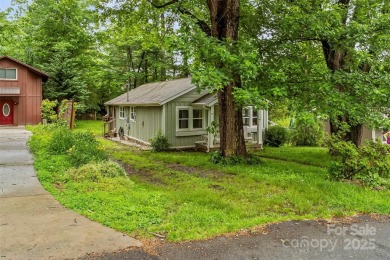 Views of Lake Tomahawk! This charming 2-bedroom/1-bath cottage on Black Mountain Golf Course in North Carolina - for sale on GolfHomes.com, golf home, golf lot