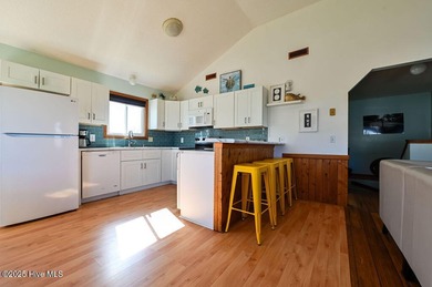 Sitting well elevated in an X flood zone, Sunny Days is located on The Currituck Golf Club in North Carolina - for sale on GolfHomes.com, golf home, golf lot