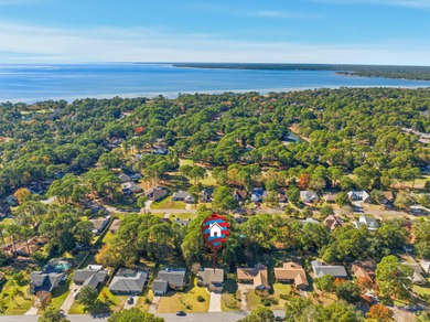 Welcome to your dream home, tucked away on a quiet street in the on Golf Club at Bluewater Bay Resort in Florida - for sale on GolfHomes.com, golf home, golf lot