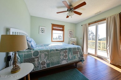 Sitting well elevated in an X flood zone, Sunny Days is located on The Currituck Golf Club in North Carolina - for sale on GolfHomes.com, golf home, golf lot