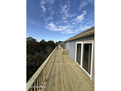 Sitting well elevated in an X flood zone, Sunny Days is located on The Currituck Golf Club in North Carolina - for sale on GolfHomes.com, golf home, golf lot