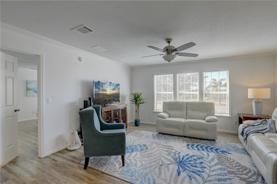 Beautifully maintained 2021 home offering over 2,000 sq ft of on Barefoot Bay Golf Course in Florida - for sale on GolfHomes.com, golf home, golf lot