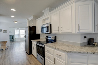 Beautifully maintained 2021 home offering over 2,000 sq ft of on Barefoot Bay Golf Course in Florida - for sale on GolfHomes.com, golf home, golf lot