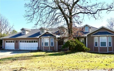 Welcome to this spacious two-level home offering 5 bedrooms, 2.5 on Vache-Grasse Country Club in Arkansas - for sale on GolfHomes.com, golf home, golf lot