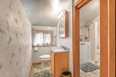 Charming midcentury brick colonial on coveted Lake Dr offers on Grant Park Golf Course in Wisconsin - for sale on GolfHomes.com, golf home, golf lot
