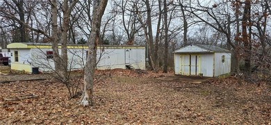 Calling all investors and weekend retreat seekers! If you love on Linn Valley Lakes - Deer Trace Golf Course in Kansas - for sale on GolfHomes.com, golf home, golf lot