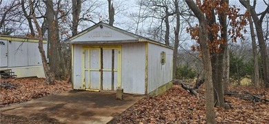 Calling all investors and weekend retreat seekers! If you love on Linn Valley Lakes - Deer Trace Golf Course in Kansas - for sale on GolfHomes.com, golf home, golf lot