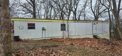 Calling all investors and weekend retreat seekers! If you love on Linn Valley Lakes - Deer Trace Golf Course in Kansas - for sale on GolfHomes.com, golf home, golf lot