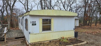 Calling all investors and weekend retreat seekers! If you love on Linn Valley Lakes - Deer Trace Golf Course in Kansas - for sale on GolfHomes.com, golf home, golf lot